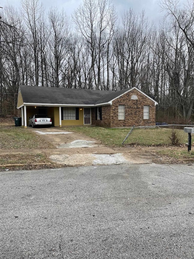 view of front of property with a carport