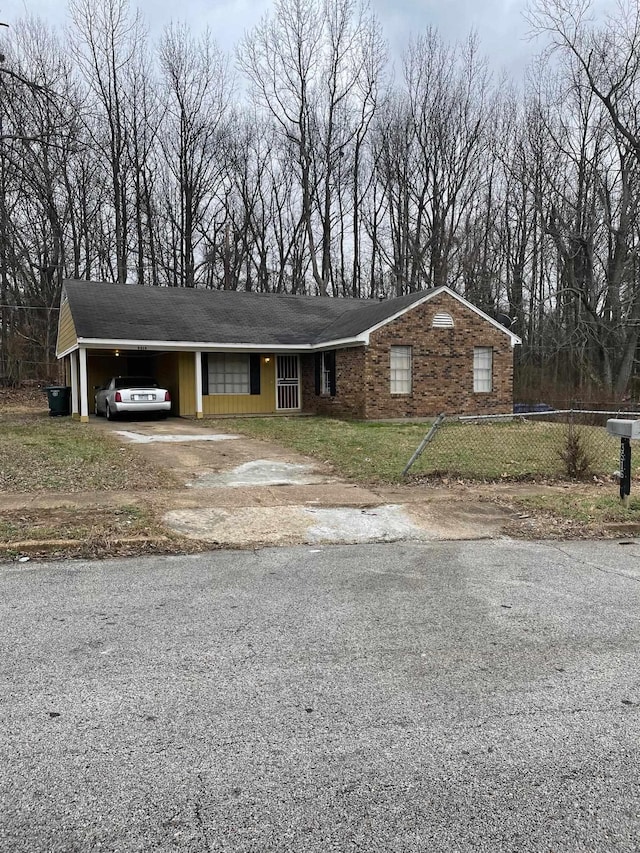 3516 Suzanne Dr, Memphis, TN 38127 - ranch-style house with driveway and an attached carport