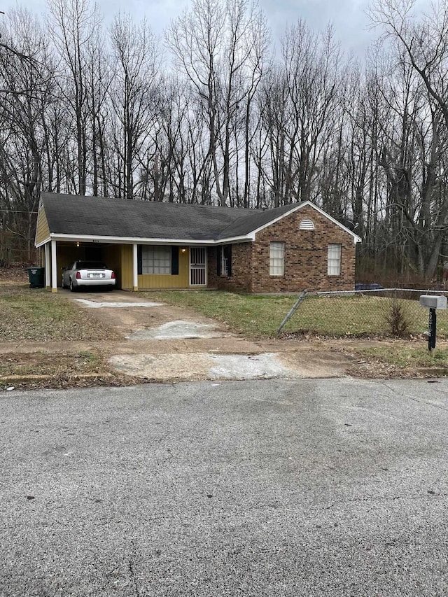 3516 Suzanne Dr, Memphis, TN 38127 - ranch-style house with driveway and an attached carport