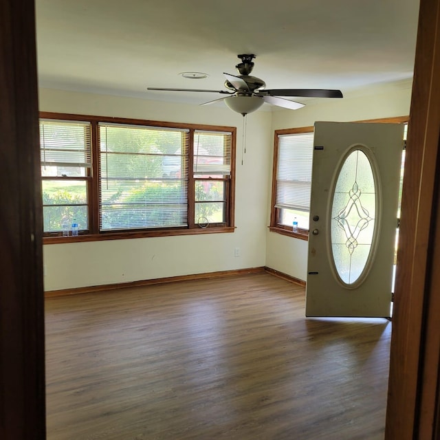 1781 Woodburn Dr, Memphis, TN 38127 - entryway with ceiling fan, wood finished floors, and baseboards