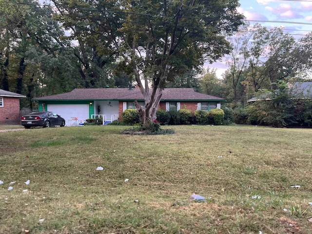 ranch-style house with a front lawn and a garage