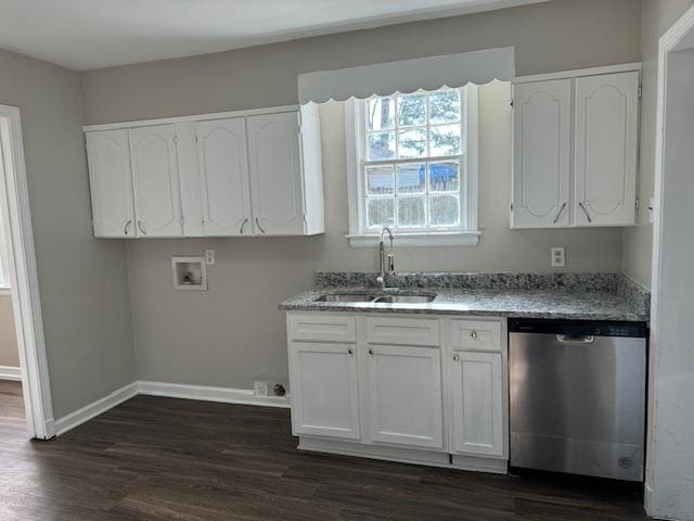 kitchen featuring light stone counters, stainless steel dishwasher, sink, white cabinets, and dark hardwood / wood-style floors