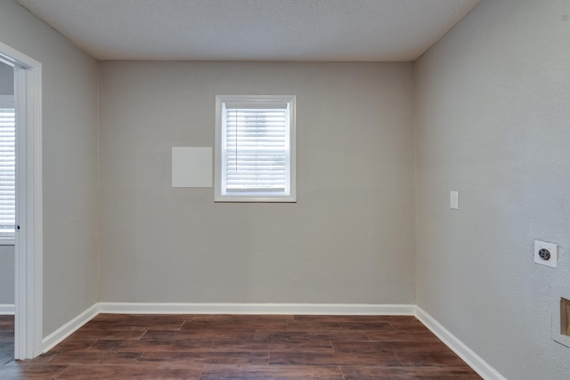 spare room featuring dark hardwood / wood-style floors