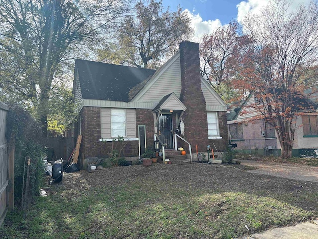 bungalow-style house with a front yard