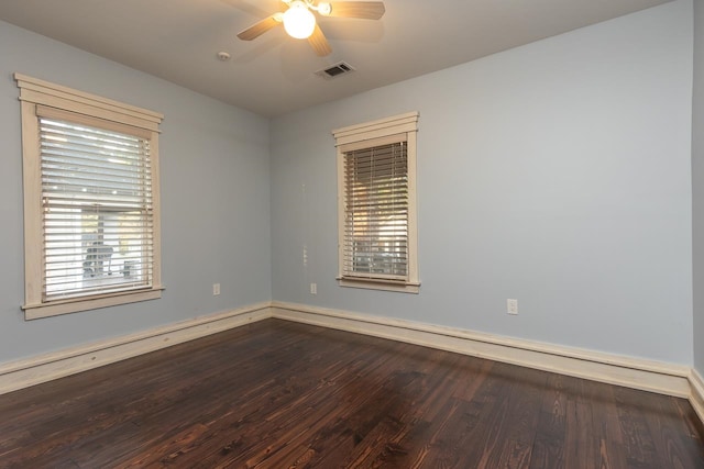 spare room featuring hardwood / wood-style floors and ceiling fan