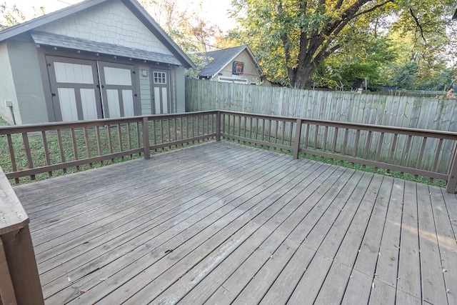 wooden deck featuring a shed