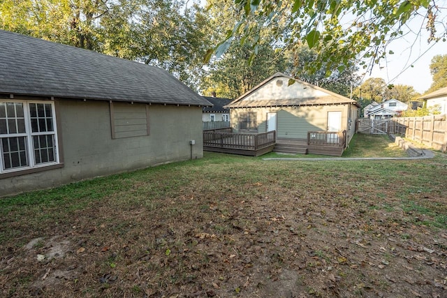 view of yard with a wooden deck