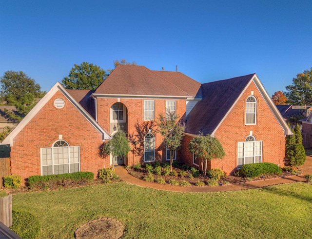 view of front of property with a front lawn