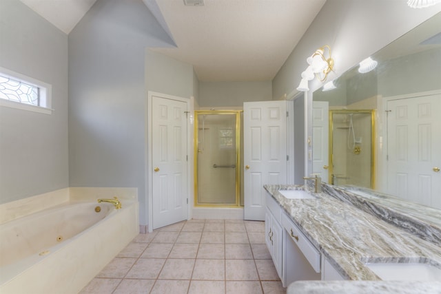 bathroom with tile patterned flooring, vanity, separate shower and tub, and vaulted ceiling