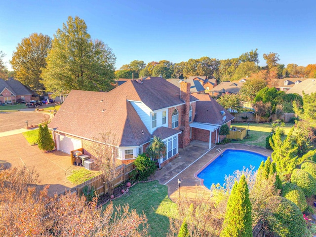 view of swimming pool with a patio and a lawn