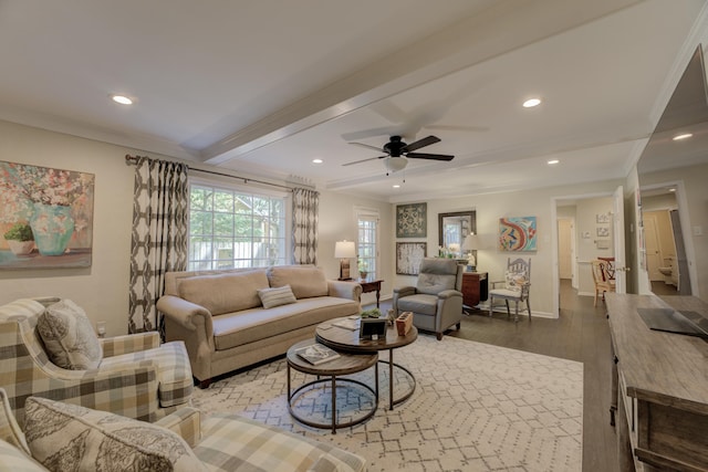 living room with beamed ceiling, ceiling fan, wood-type flooring, and crown molding