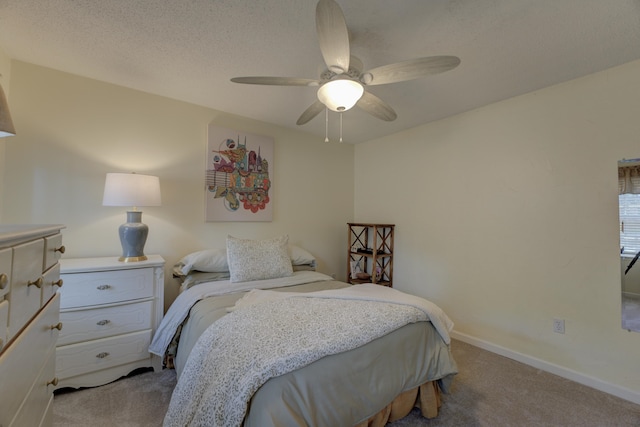 bedroom with ceiling fan and light colored carpet