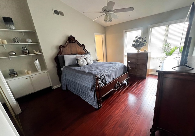 bedroom with ceiling fan, dark hardwood / wood-style flooring, and lofted ceiling