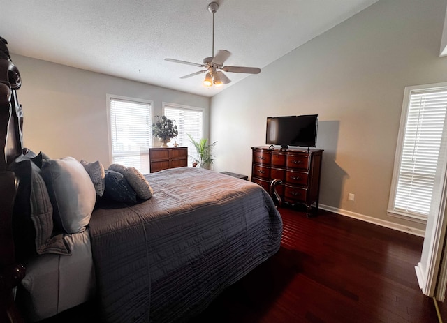 bedroom with a textured ceiling, ceiling fan, dark hardwood / wood-style flooring, and lofted ceiling