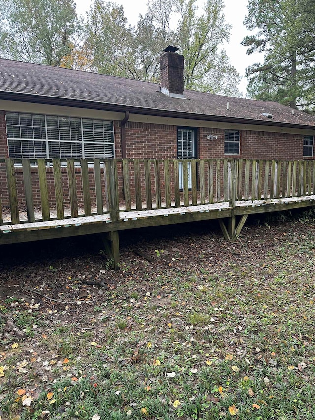 back of property featuring a deck