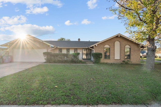 single story home with a garage and a front yard