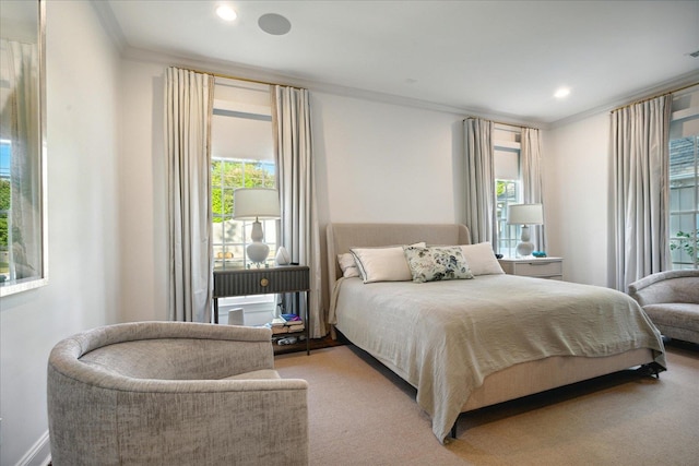 carpeted bedroom featuring multiple windows and crown molding