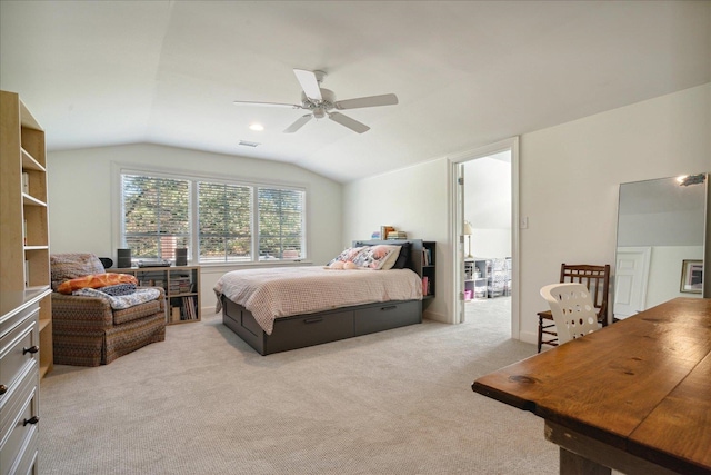 carpeted bedroom with ceiling fan and lofted ceiling