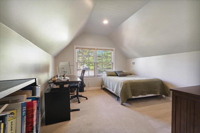 bedroom featuring light colored carpet and lofted ceiling