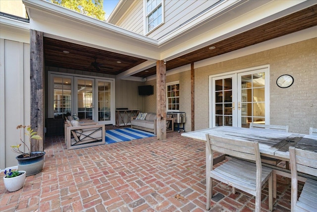 view of patio / terrace featuring ceiling fan and french doors