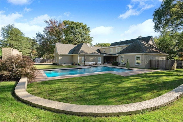 view of pool featuring a lawn, a patio area, and an outdoor living space