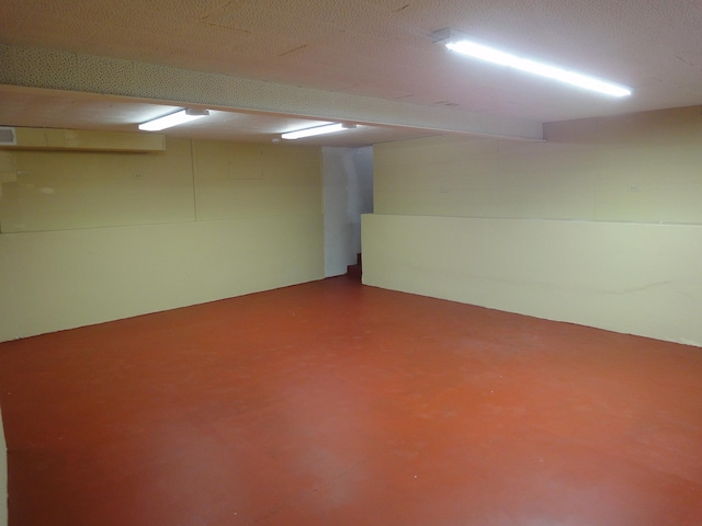 basement with a textured ceiling