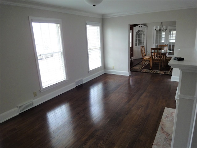 interior space with crown molding, dark wood-type flooring, and a notable chandelier