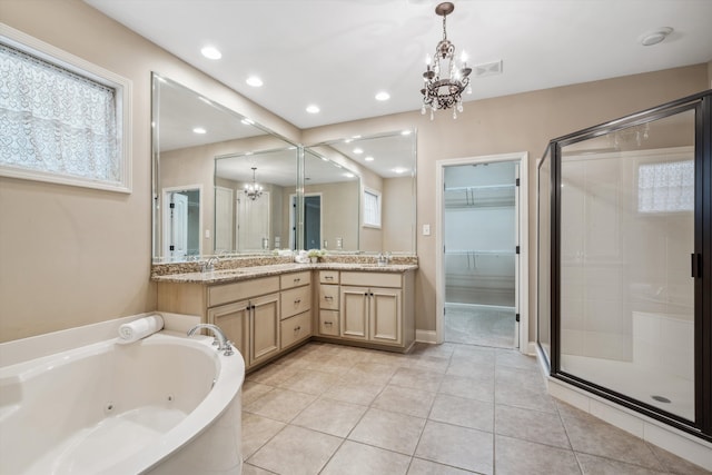 bathroom featuring plenty of natural light, vanity, independent shower and bath, and an inviting chandelier