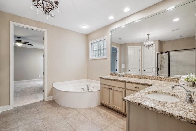 bathroom featuring tile patterned flooring, ceiling fan with notable chandelier, shower with separate bathtub, and vanity