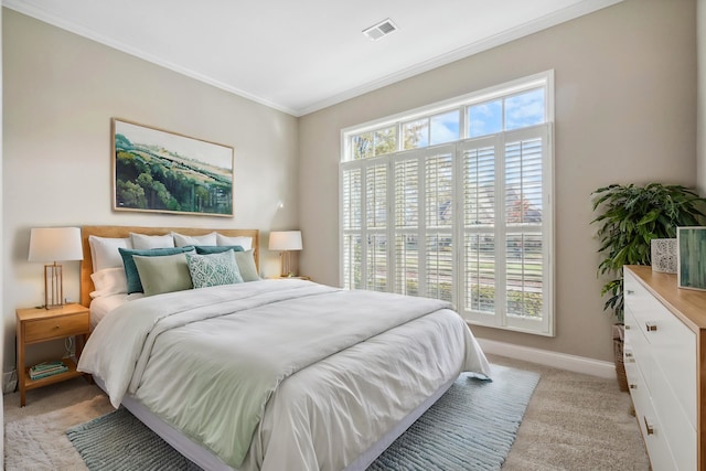 carpeted bedroom featuring crown molding