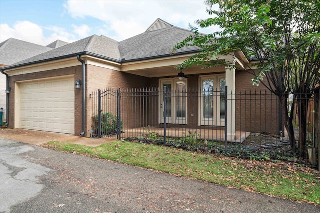 view of front of property with a garage