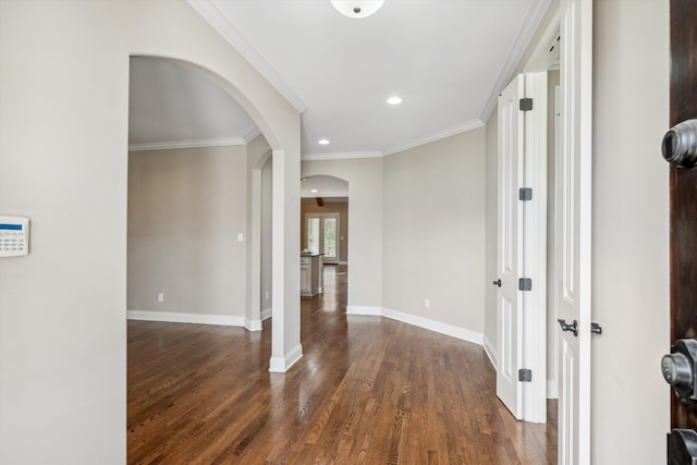 hall featuring crown molding and dark wood-type flooring