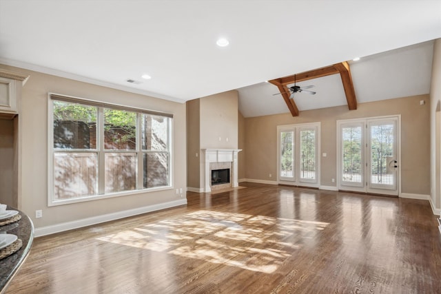 unfurnished living room with lofted ceiling with beams, ceiling fan, wood-type flooring, and a premium fireplace