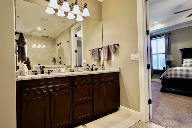 bathroom featuring vanity, ornamental molding, and a tile shower