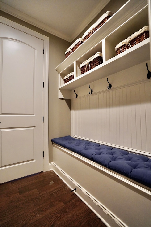 mudroom with dark wood-type flooring and ornamental molding