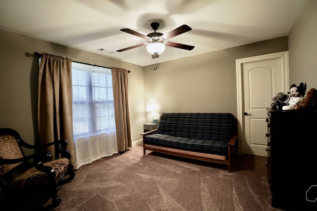 sitting room featuring carpet floors and ceiling fan