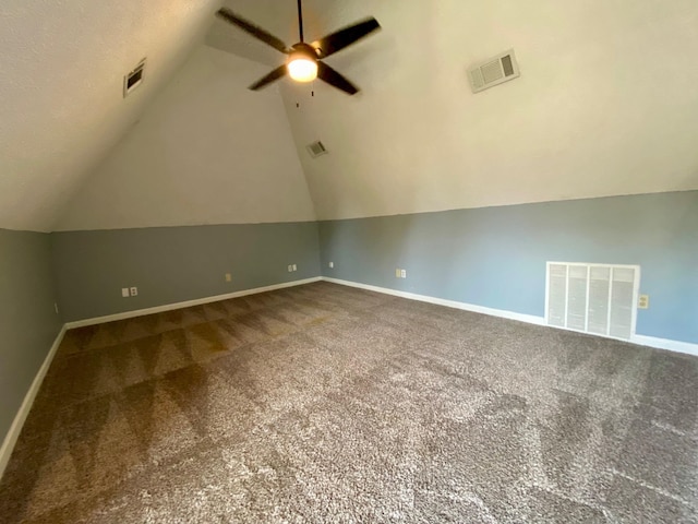 additional living space with carpet flooring, ceiling fan, and vaulted ceiling