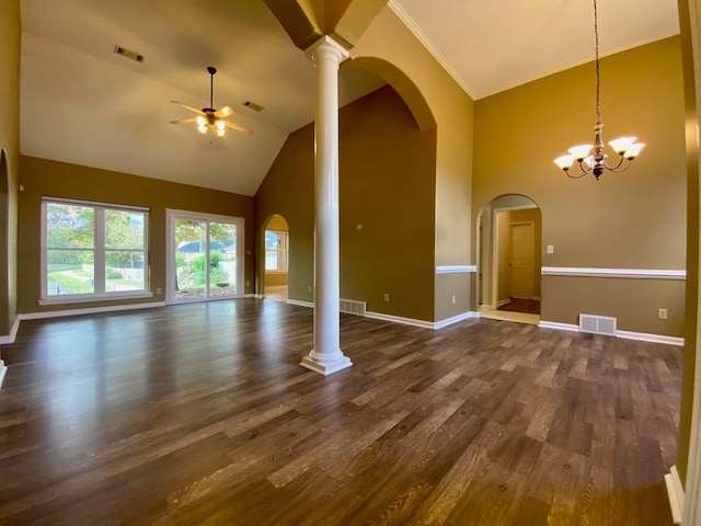 unfurnished living room with decorative columns, ornamental molding, ceiling fan with notable chandelier, high vaulted ceiling, and dark hardwood / wood-style floors