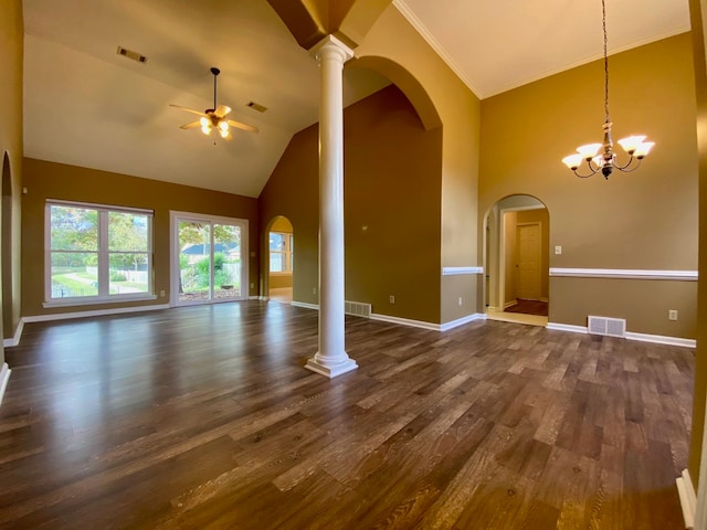 unfurnished living room with ceiling fan with notable chandelier, crown molding, dark wood-type flooring, and high vaulted ceiling