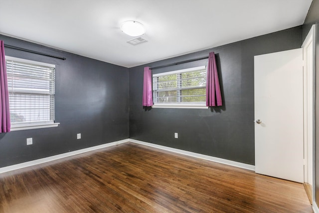 unfurnished room featuring hardwood / wood-style floors