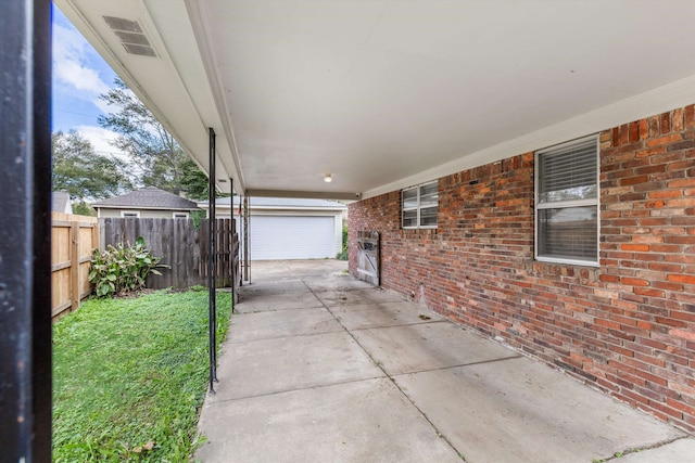 view of patio / terrace with a garage