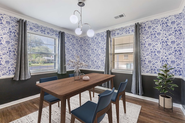 dining space with crown molding, plenty of natural light, and dark wood-type flooring