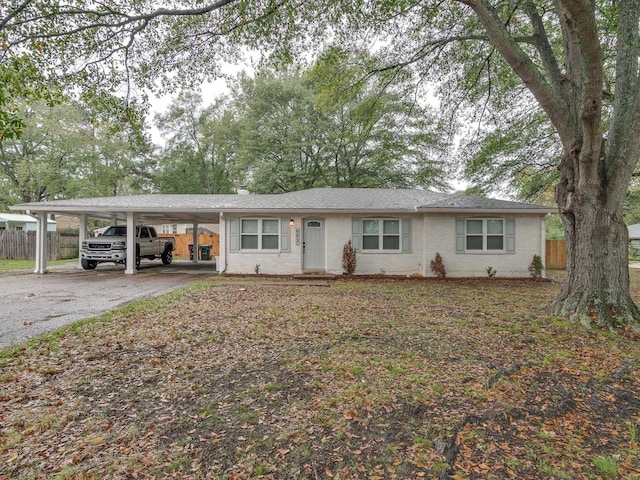 ranch-style house with a carport