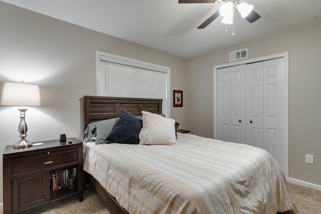 bedroom with light carpet, a closet, and ceiling fan