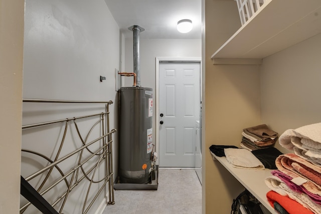 utility room featuring water heater