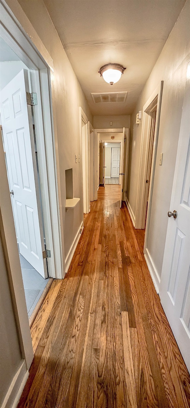 hall featuring wood-type flooring