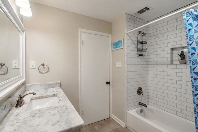 bathroom featuring tile patterned flooring, shower / bath combination with curtain, and vanity