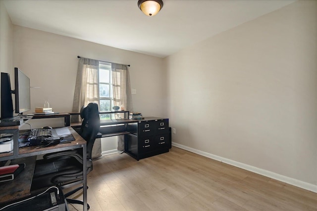 office space with light hardwood / wood-style flooring