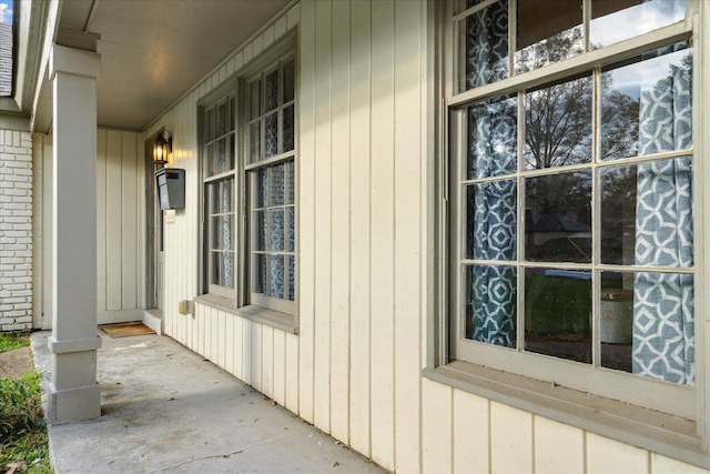 view of side of home with a porch