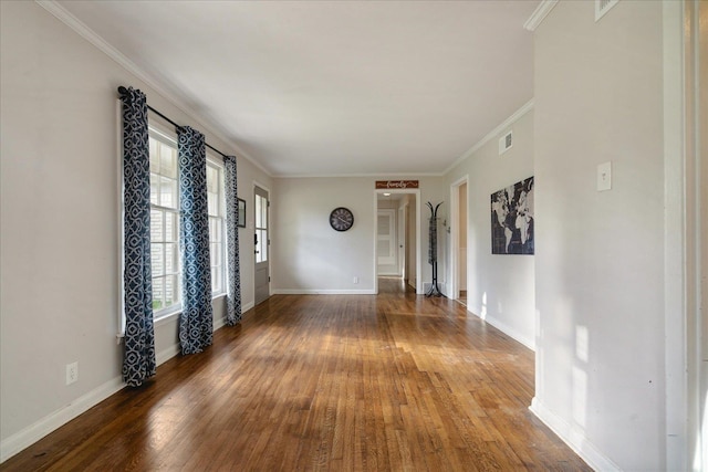 unfurnished room with crown molding and hardwood / wood-style flooring